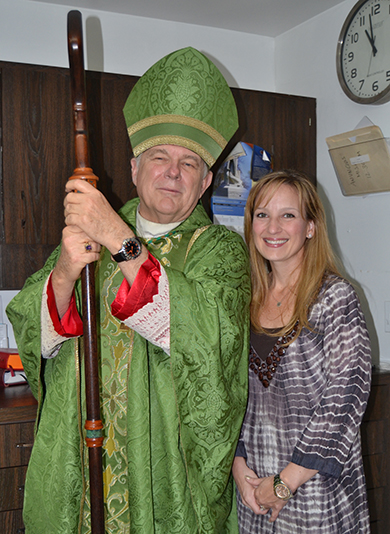 Archbishop Wenski poses with Katie Blanco Crocquet, president of the Archdiocese of Miami Development Corporation, before the ThanksForGiving Mass.