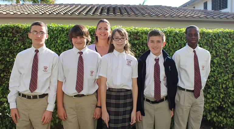 Team members Ethan Clerkin, Austin Hamawy, Shannon Vogel, Logan Paolillo and Samuel Alexander won $ 100 scholarships to Cardinal Gibbons High School. They are pictured with teacher Kathy Aprea-Cook.