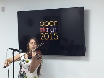 Junior Gabriela Gutierrez plays the violin at the Msgr. Pace High Literary Guild's annual Open Mic Night inside the school's Innovation Center.