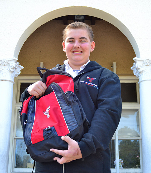Parker Stevens shows off some of the memorabilia he brought back from his visit with his favorite team, the Chicago Bulls. The October visit was made possible by the Make-A-Wish Foundation.
