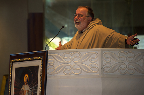 Father Philip Scott, of the Congregation of St. John, preaches the homily during the Mass that was celebrated during the one-day Women of Grace conference.