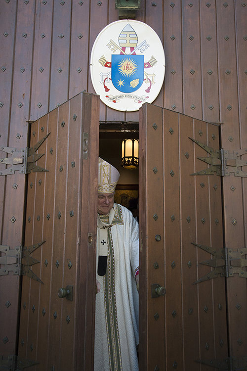 Archbishop Thomas Wenski closes the Holy Door at St. Mary Cathedral after the Thanks-for-Giving Mass Nov. 20, feast of Christ the King and closing day of the Jubilee Year of Mercy.
