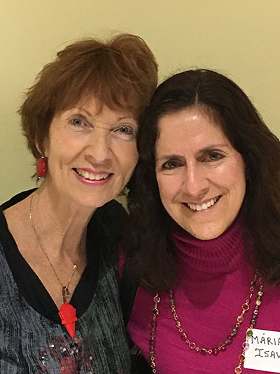 Dolores Hanley McDiarmid, left, poses after her book signing with Maria Isava from Mary Help of Christians Parish in Parkland. They attended St. Thomas University's Pastoral Ministries Program together.