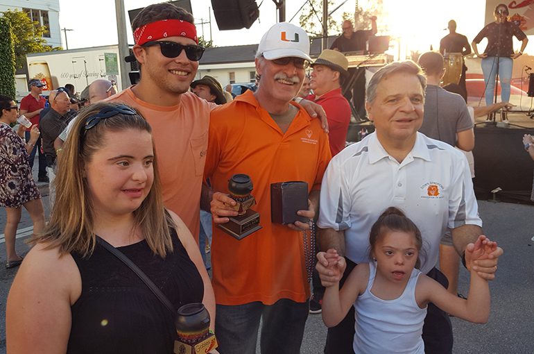 Posing with their second place Judge's Choice award for their pot of chili are members of the Down Syndrome Association of Miami team.