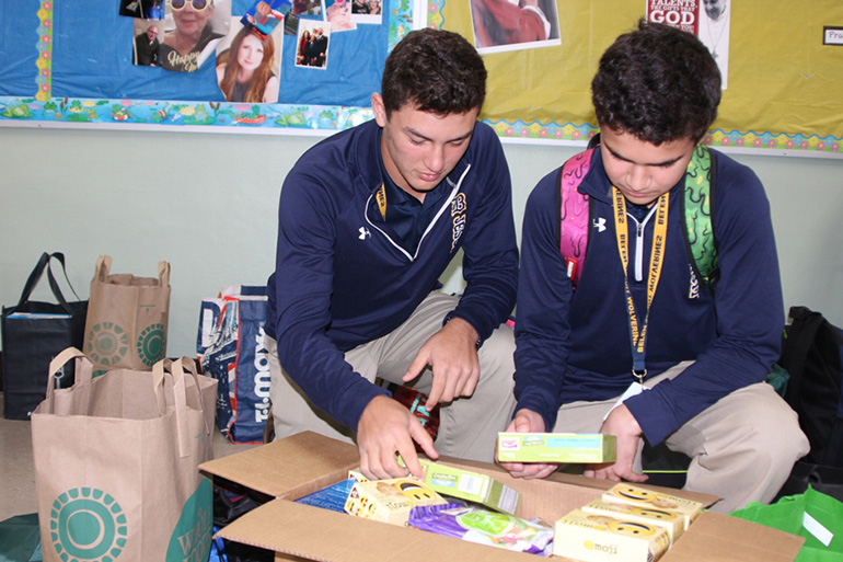 Belen Jesuit's seventh graders assemble care packages for the homeless which will be distributed to the Missionaries of Charity.