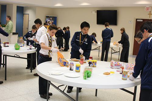 Belen Jesuit Prep's sixth graders make sunflower seed butter and jelly sandwiches for the homeless of Camillus House and the Missionaries of Charity during the culmination of Ignatian Week March 17.