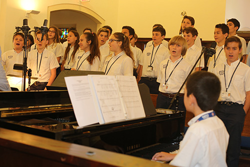 A student choir sings at the Mass for 90th anniversary of St. Anthony School, April 3 in Fort Lauderdale.