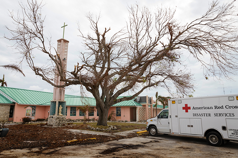 An American Red Cross vehicle is parked among the debris at the Miami archdiocesan church most devastated by Hurricane Irma, St. Peter the Fisherman in Big Pine Key. The church has been deemed unusable and is expected to be rebuilt.