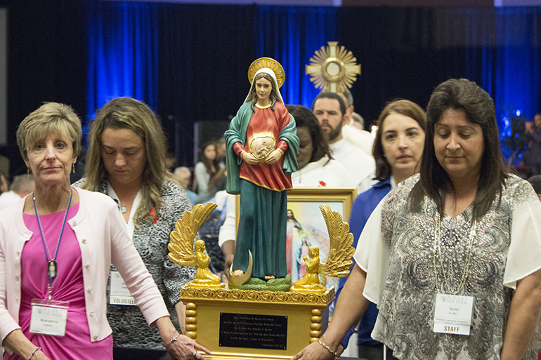 Respect life volunteers carry the statue of Mary, Ark of the New Covenant and Vessel of the Preborn Jesus in procession at the conclusion of the opening session of the 31st annual Respect Life State Conference, 