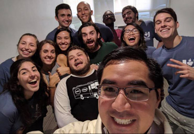 Father Phillip Tran takes one of his first selfies as UM Catholic Campus Minister with some of his UCatholics in their new UM Catholic campus ministry suite in Pentland House at the University of Miami.
