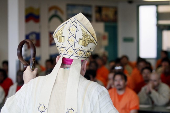 Archbishop Thomas Wenski celebrates Mass on Christmas day with 145 detainees at Krome Service Processing Center in southwest Miami- Dade County.