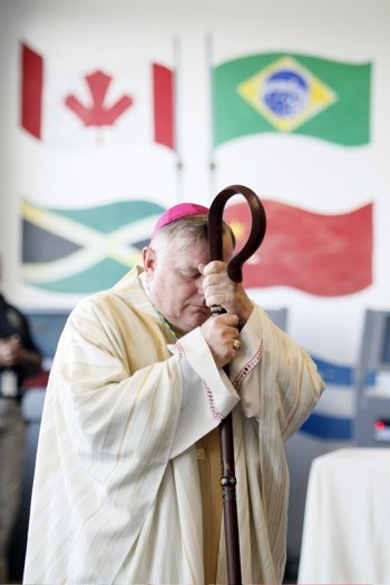 Archbishop Wenski reflects during the proclamation of the Gospel during the Christmas Mass at Krome.