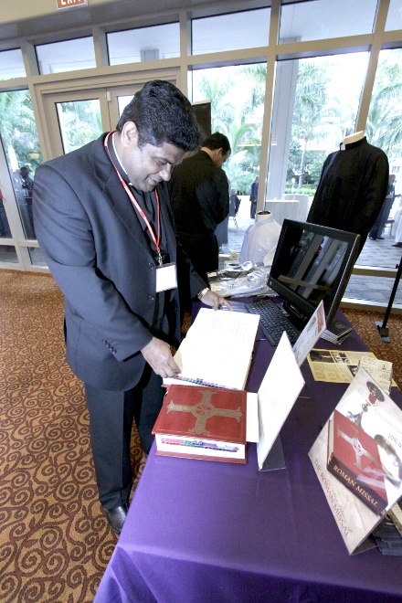 Father George Packuvetthara, parochial vicar at St. David Church in Davie, checks out the new English translation of the Roman Missal.
