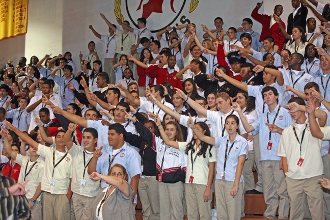 Pace High School students stand up and sing their alma mater.