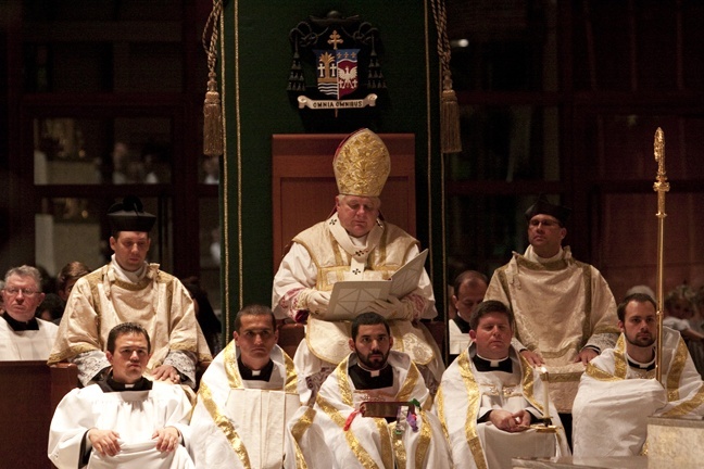 Archbishop Thomas Wenski reads his homily, the only part of the Mass said in English.