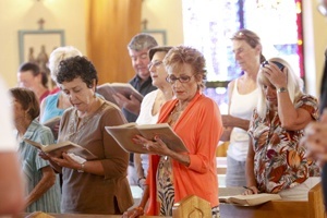 Participants at the listening session in San Pablo sing a hymn to begin the session.