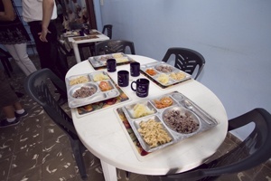 Table is set at the feeding program for the elderly operated by Sacred Heart Parish in the Los Pinos section of Havana. It was the first lunch and socialization project for the elderly officially funded by the Cuban Association of the Knights of Malta, and it began in 1999.