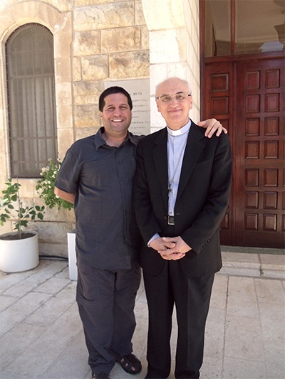 David Masters poses with the papal nuncio to Israel, Archbishop Giuseppe Lazzarotto, one of the people the Catholic educators met with during their stay in the Holy Land.