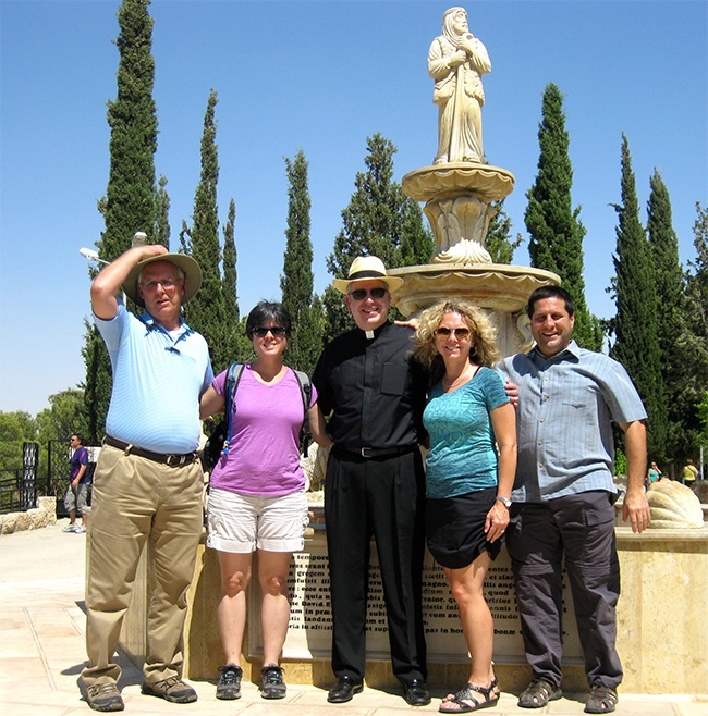 At the Shepherds' Field near Bethlehem, David Masters, far right, poses with fellow Bearing Witness travelers John Thomas, Donna Tarney, ather Michael Dolan, director of vocations for the Archdiocese of Hartford, Conn., and Robin Siczek.