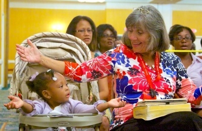 Two-year-year-old Liah Aurelien of St Bartholomew and Valli Leone of Key Largo were among hundreds that participated in the 32nd annual Catholic Charismatic Conference.