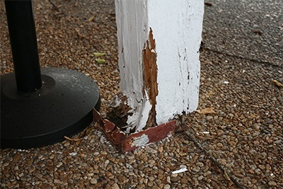Rotted wood columns hold up the awning above the entrance to St. Maurice Church. The parish cannot afford to make the extensive repairs that would make the building safe once more.