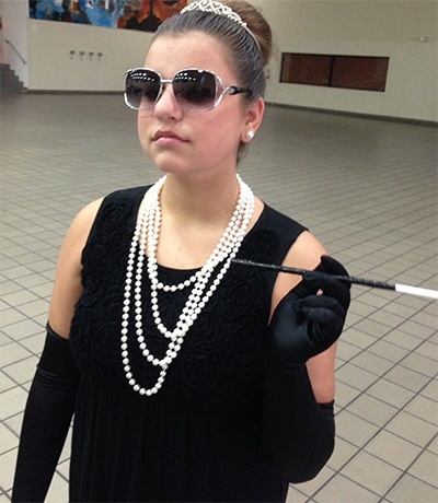 Our Lady of the Lakes student Elizabeth Maisello dresses up as Audrey Hepburn for Celebrity Day at Msgr. Edward Pace High School’s annual drama camp.