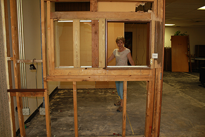 Barbara Groeber, Respect Life's director of education, marks the front of what will be the reception area at the future home of the main Respect Life Office, at 4747 Hollywood Boulevard in Hollywood.