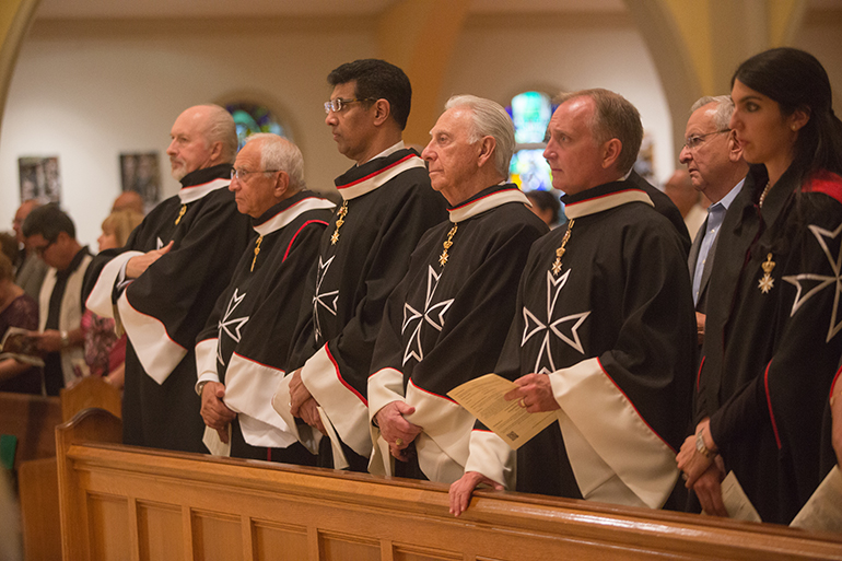 Knights of Malta take part in the Mass for families of the incarcerated. The Knights donated 9,500 Bibles and prayer books to inmates around Florida last year.