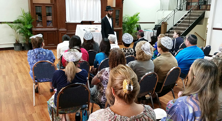 A group of people who are blind and visually impaired, sighted, Jewish, Catholic, Christian, and Muslim, came together Oct. 12 to learn about and experience the holiday of Sukkot.