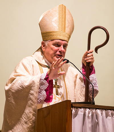 Miami Archbishop Thomas Wenski speaks to the community of Our Lady Queen of Heaven Parish in Fort Lauderdale during the 40th anniversary Mass and celebration for the parish, held Oct. 22.