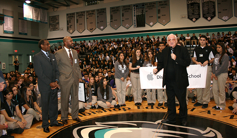 Father Dalton speaks to McCarthy High's student body following the Apple Distinguished School presentation by Apple representatives.