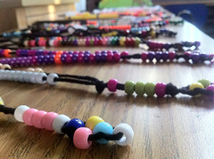 Children made rosaries for themselves and for children in Haiti, which were taken to that country by one of the mission trip teams.