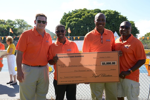 Posing at the tennis court dedication ceremony, from left: Douglas Romanik `84, Curley Notre Dame principal; Jean Desdunes `79, USTA Florida senior director of Diversity and Inclusion Programs; Derrick Davison `78, USTA Georgia director of competition; and Jean Pierre `87, president of the ACND Booster Club. Davison and Desdunes were on two state championship teams and Desdunes won two doubles state titles as well.