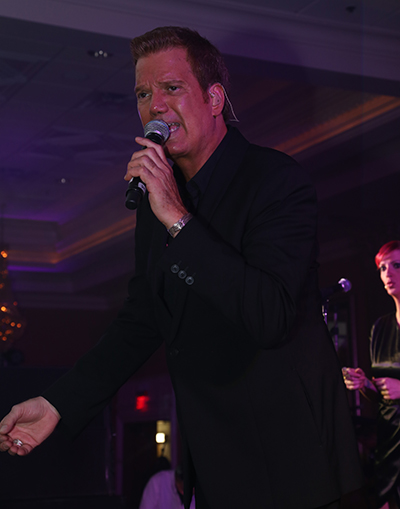 Willy Chirino a Cuban singer and Leadership Learning Center sponsor, sings at the event.