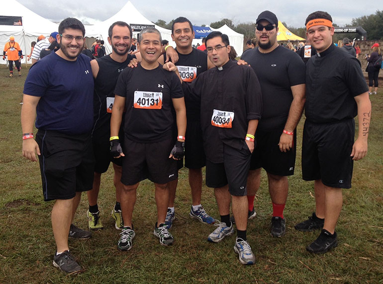 Pictured in the photo before the start of the race, from left, Miami seminarians Brian German, Kevin Garcia, Gary Delos Santos, Ion Chamorro, Deacon Philip Tran, Matthew Gomez and Deacon Bryan Garcia.
