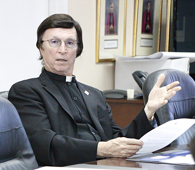 Father Paul Vuturo, pastor of St. Louis Church, shares his points of view during the orientation session for parish implementation of the synod pastoral plan, "Disciples in Faith, Missionaries of Hope."