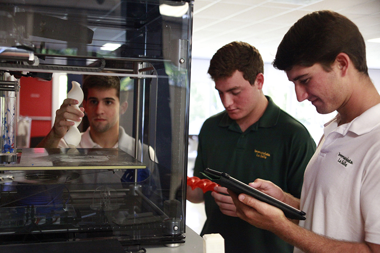 Immaculata-La Salle students work with a 3D printer as part of their STEAM (Science, Technology, Engineering, Arts and Math) curriculum.