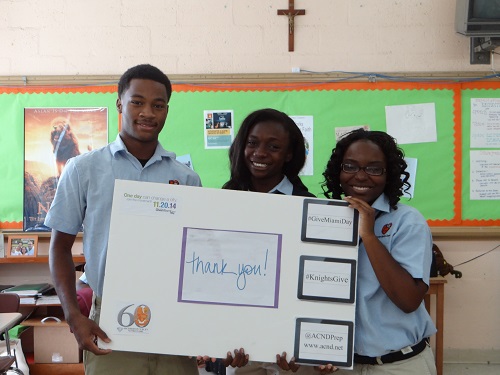 Giving thanks to donors, from left, Curley Notre Dame seniors Joshua Jacquet, Maniola Mompremier and Ketsia Dorlean.