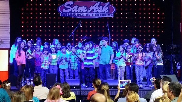 Students in first grade through middle school from Our Lady of the Lakes perform at Sam Ash Music Store in Miami Lakes.