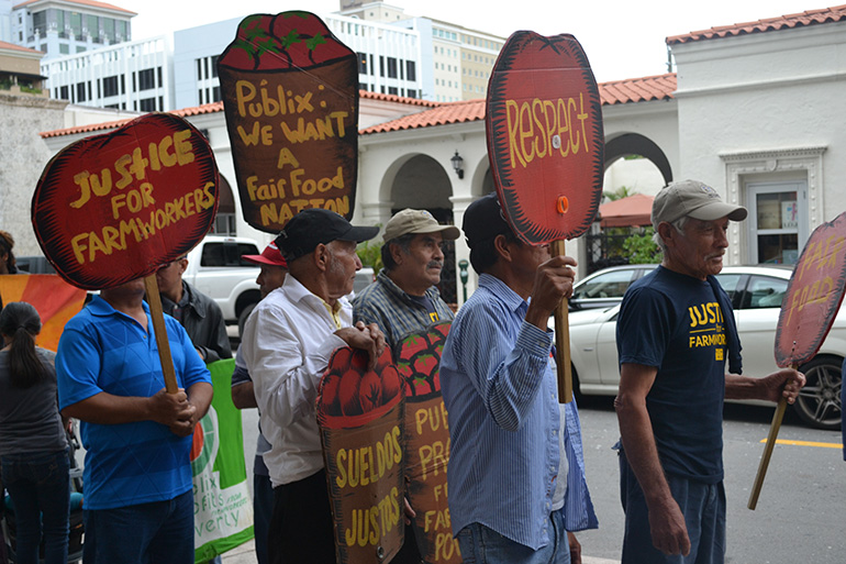 Farm workers from Immokalee demonstrate to convince Publix Supermarkets to take part in the Fair Food Program, which would pay them an extra penny per pound of tomatoes picked in Florida's fields.