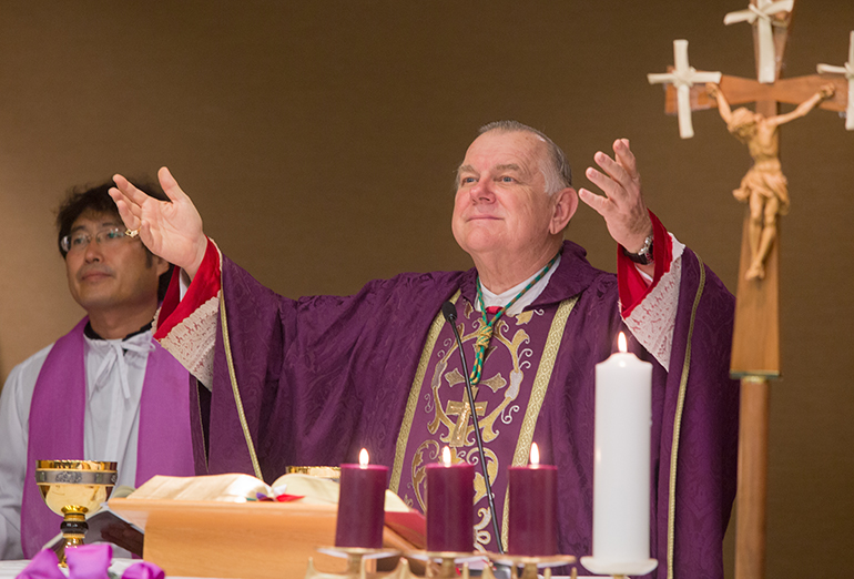 Archbishop Thomas Wenski celebrates the Mass with South Florida's Korean Catholic community alongside their pastor, Father Bongmoon Lee.
