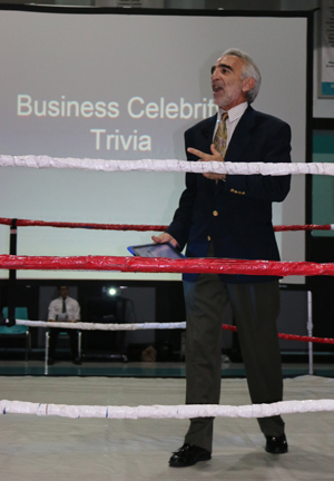 From inside the ring, Archbishop McCarthy High teacher John Anfuso emcees the second annual Mav Tank Challenge at the high school.