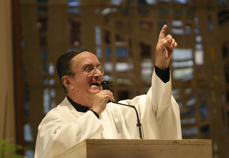 Father Ernesto Molano gestures during a 2006 Mass in honor of his 50th anniversary of ordination.