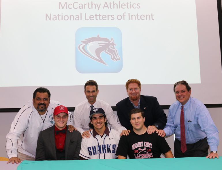 Archbishop Edward A. McCarthy High School athletes with their respective coaches are shown here during the November signing ceremony. Sitting, from left, are Christian Demby, Jake Anchia and Chris Diaz. Standing, from left, are Alex Fernandez, baseball coach, and lacrosse coaches Brent Hilsabeck, Patrick Lebowitz and Ken Delisle.