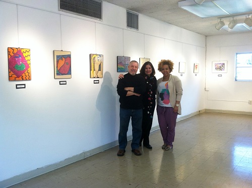 Cuqui Beguiristain (center), an alumna of Notre Dame Academy, joins her husband MANO and Alexia Jean-Jacques, alumni and events coordinator (right) in the ACND Gallery at Archbishop Curley Notre Dame.