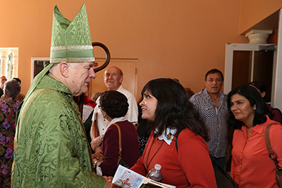 Archbishop Thomas Wenski blesses Our Lady of Lourdes parishioners after the Mass.