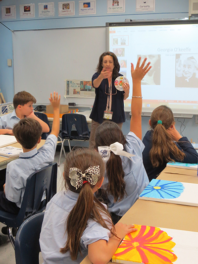 Art teacher Gigi Shaheen doesn't just hand out brushes and paint in her class. Before students can complete their work imitating Georgia O'Keefe's creations, Shaheen discusses and quizzes them on O'Keefe's style and use of color.