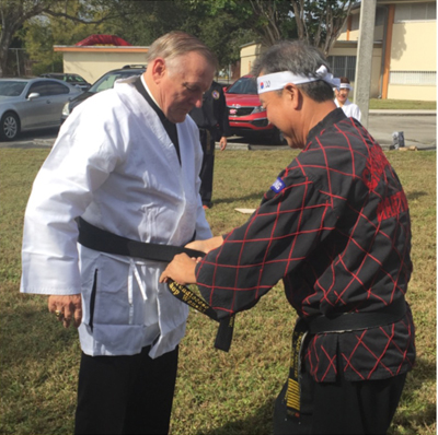 COURTESY PHOTO|

As part of the celebration, the Catholic Korean community presented Archbishop Thomas Wenski with an honorary black belt in Tae Kwon Do.