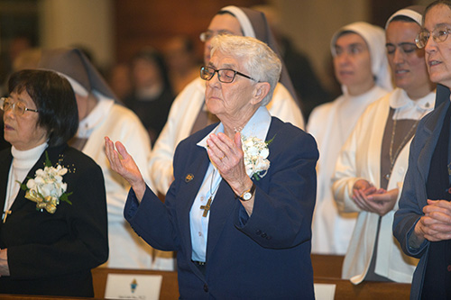 Sister Mary Patricia Hale, of the Sisters of Notre Dame de Namur, who was celebrating 70 years of religious life, prays The Lord's Prayer.