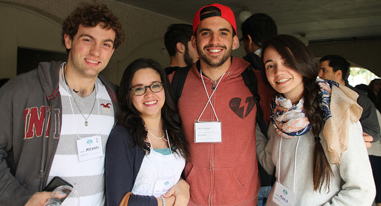 Young adults Michael Derp, Blanca Morales, Ricky Vazquez and Maria Corina Benatuil pose for a photo during the young adult retreat hosted by seminarians at St. Vincent de Paul Seminary in Boynton Beach.